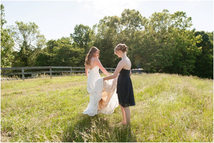 bridal portraits on wedding day in tall grassy field and rustic farm wedding and lace dress