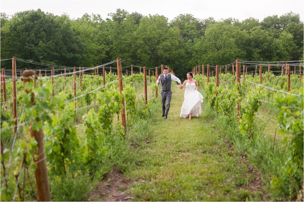 Seneca Lake NY Vineyard Wedding ceremony photos, bride and groom portraits in vines at vineyard