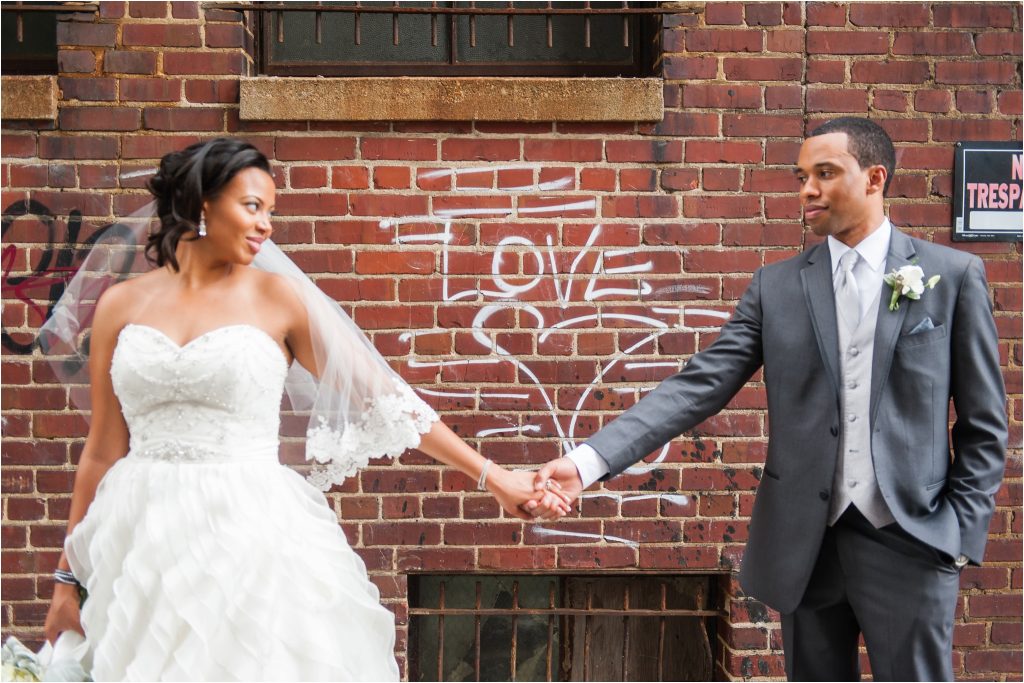 The John Marshall Ballroom bride and groom portrait with graffiti love photo