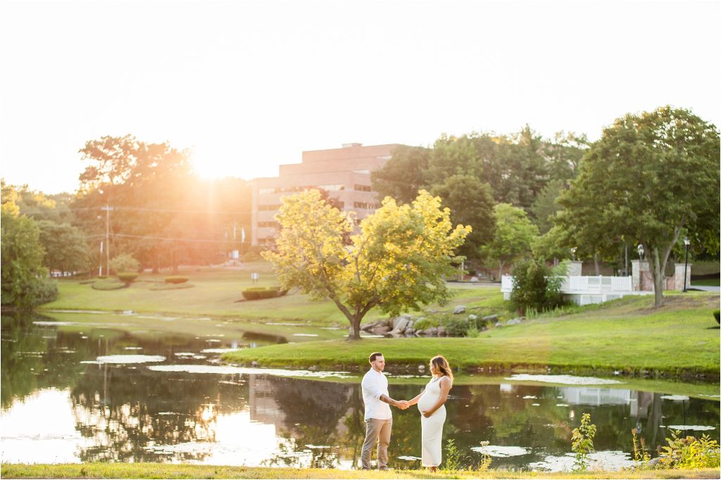 Couple outdoor Maternity Photos by lake with sunset 